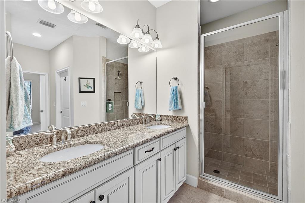 9419 Benvenuto Court, Unit 202 Naples, FL 34119 - Photo 19 of 44 Primary Bath with Dual Sinks
