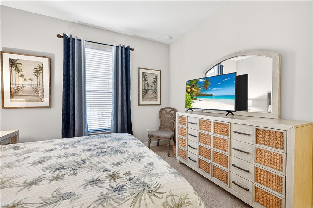 9419 Benvenuto Court, Unit 202 Naples, FL 34119 - Photo 21 of 44 Guest Bedroom