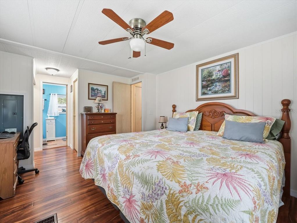 1422 North Reed Terrace Inverness, FL 34453 - Photo 18 of 39 a bedroom with bed and wooden floor