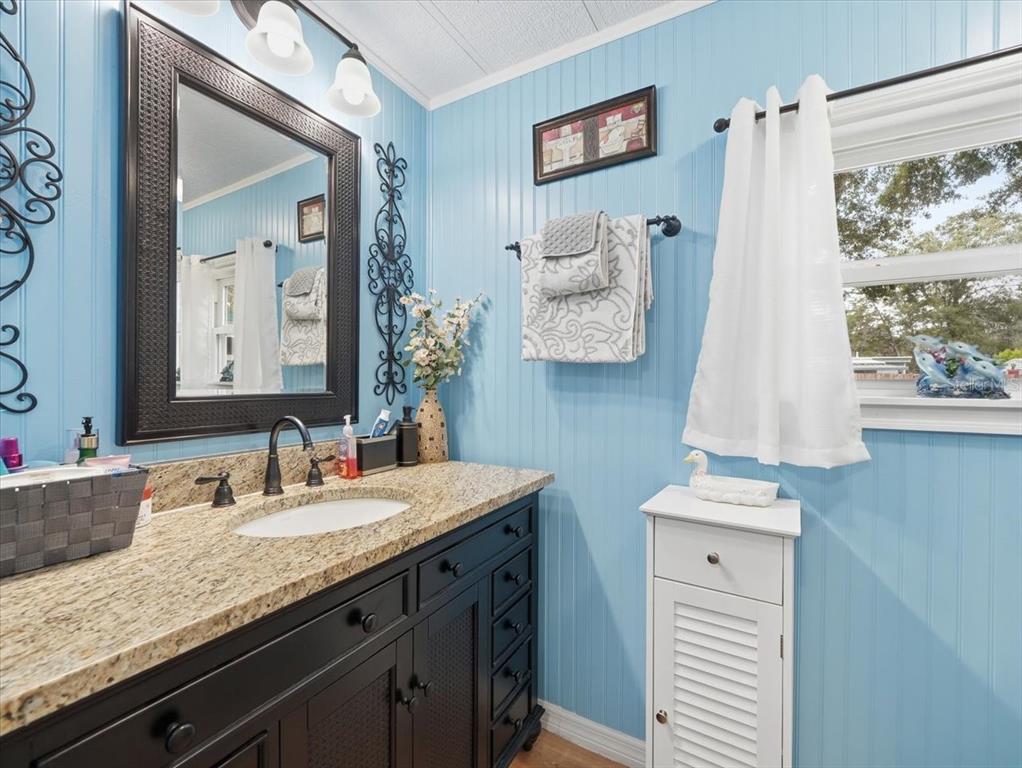 1422 North Reed Terrace Inverness, FL 34453 - Photo 20 of 39 a bathroom with a sink vanity and a mirror