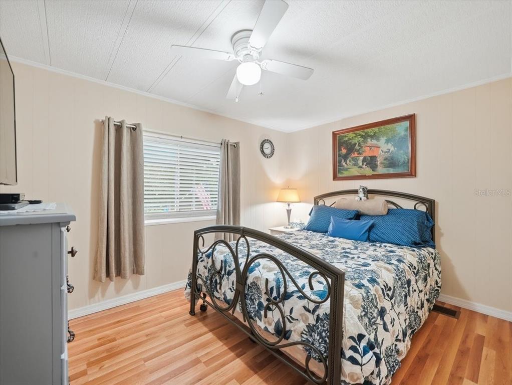 1422 North Reed Terrace Inverness, FL 34453 - Photo 22 of 39 a bed sitting in a bedroom next to a window