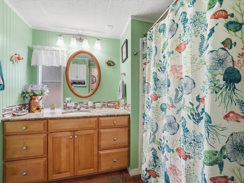 1422 North Reed Terrace Inverness, FL 34453 - Photo 25 of 39 a bathroom with a sink and a mirror