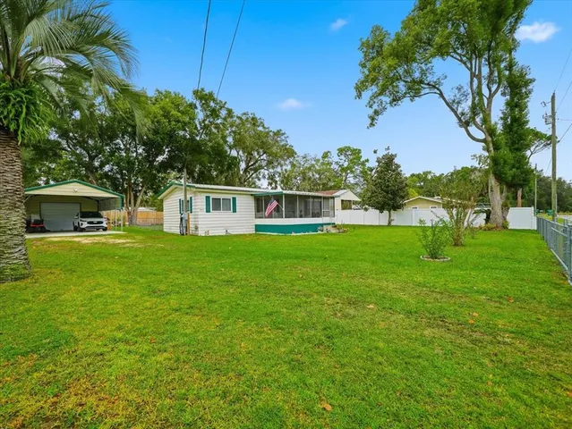 a house view with swimming pool in front of it