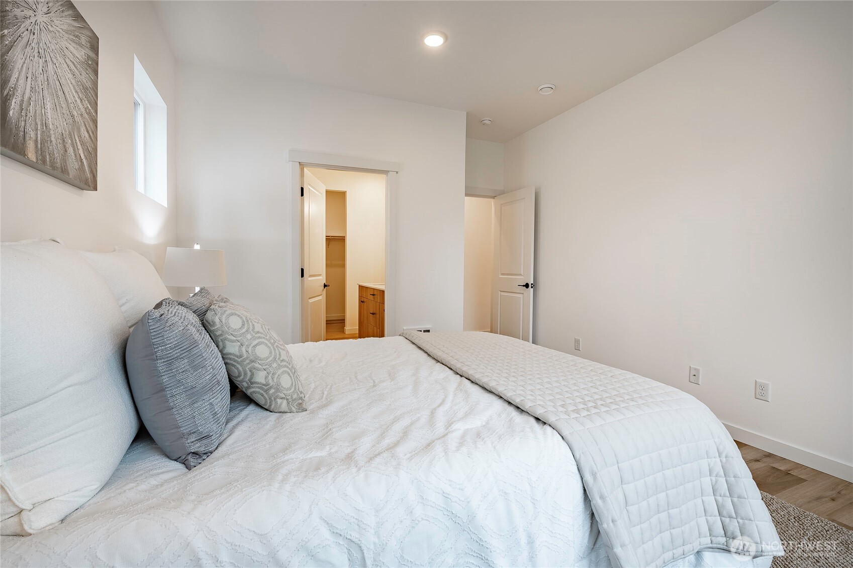 2999 Cedar View Road Blaine, WA 98230 - Photo 17 of 37 a spacious bedroom with a bed and a lamp