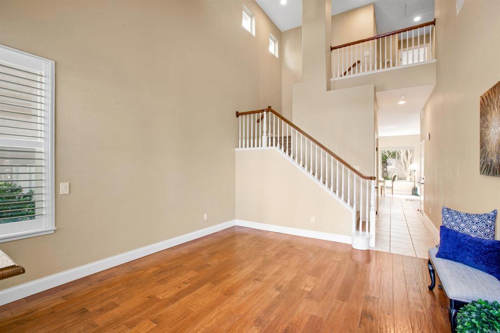 7159 Tanager Drive Carlsbad, CA 92011 - Photo 12 of 68 a view of entryway and hall with wooden floor
