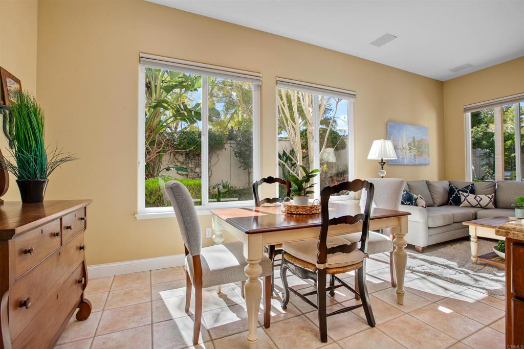 7159 Tanager Drive Carlsbad, CA 92011 - Photo 20 of 68 a dining room with furniture and a large window