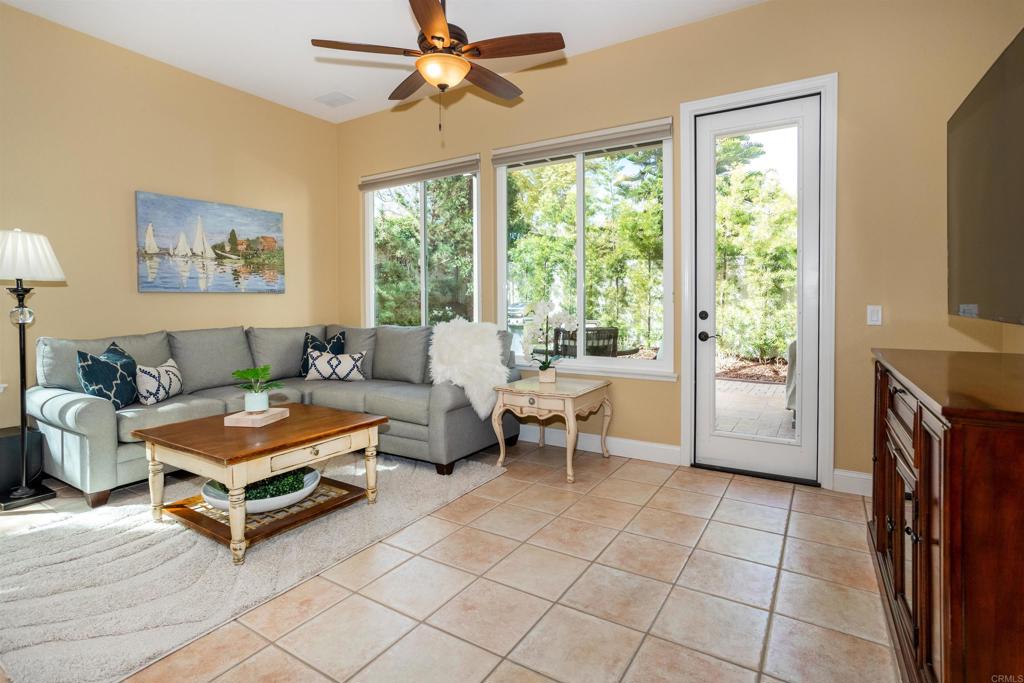 7159 Tanager Drive Carlsbad, CA 92011 - Photo 25 of 68 a living room with furniture and a flat screen tv