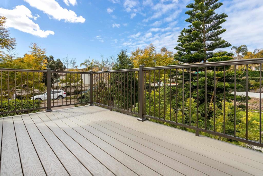 7159 Tanager Drive Carlsbad, CA 92011 - Photo 39 of 68 a view of a balcony with wooden floor and city view