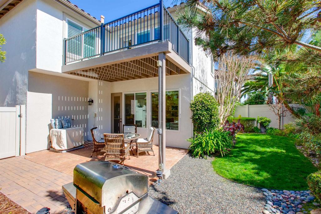 7159 Tanager Drive Carlsbad, CA 92011 - Photo 41 of 68 a view of a house with backyard sitting area and garden