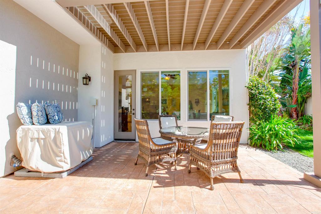 7159 Tanager Drive Carlsbad, CA 92011 - Photo 43 of 68 a building outdoor space with patio furniture and potted plants