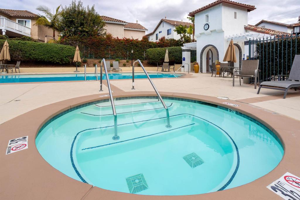 7159 Tanager Drive Carlsbad, CA 92011 - Photo 53 of 68 a view of a swimming pool with an outdoor space