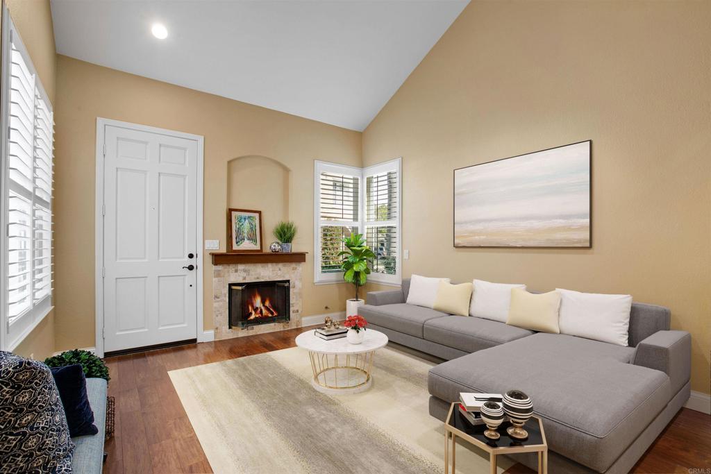 7159 Tanager Drive Carlsbad, CA 92011 - Photo 10 of 68 a living room with furniture fireplace and window