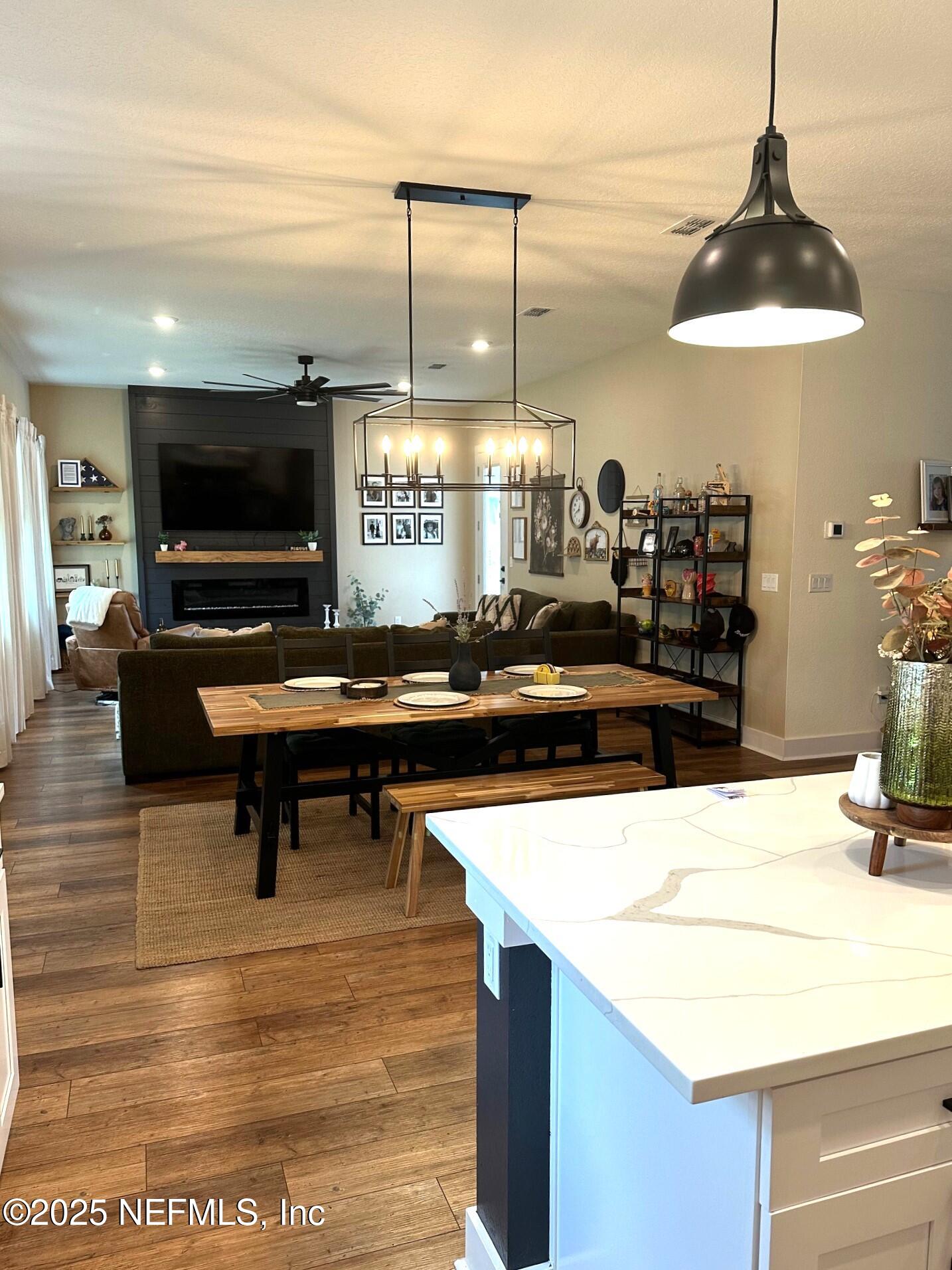 36079 Pitch Lane Hilliard, FL 32046 - Photo 35 of 35 a living room with furniture and a flat screen tv