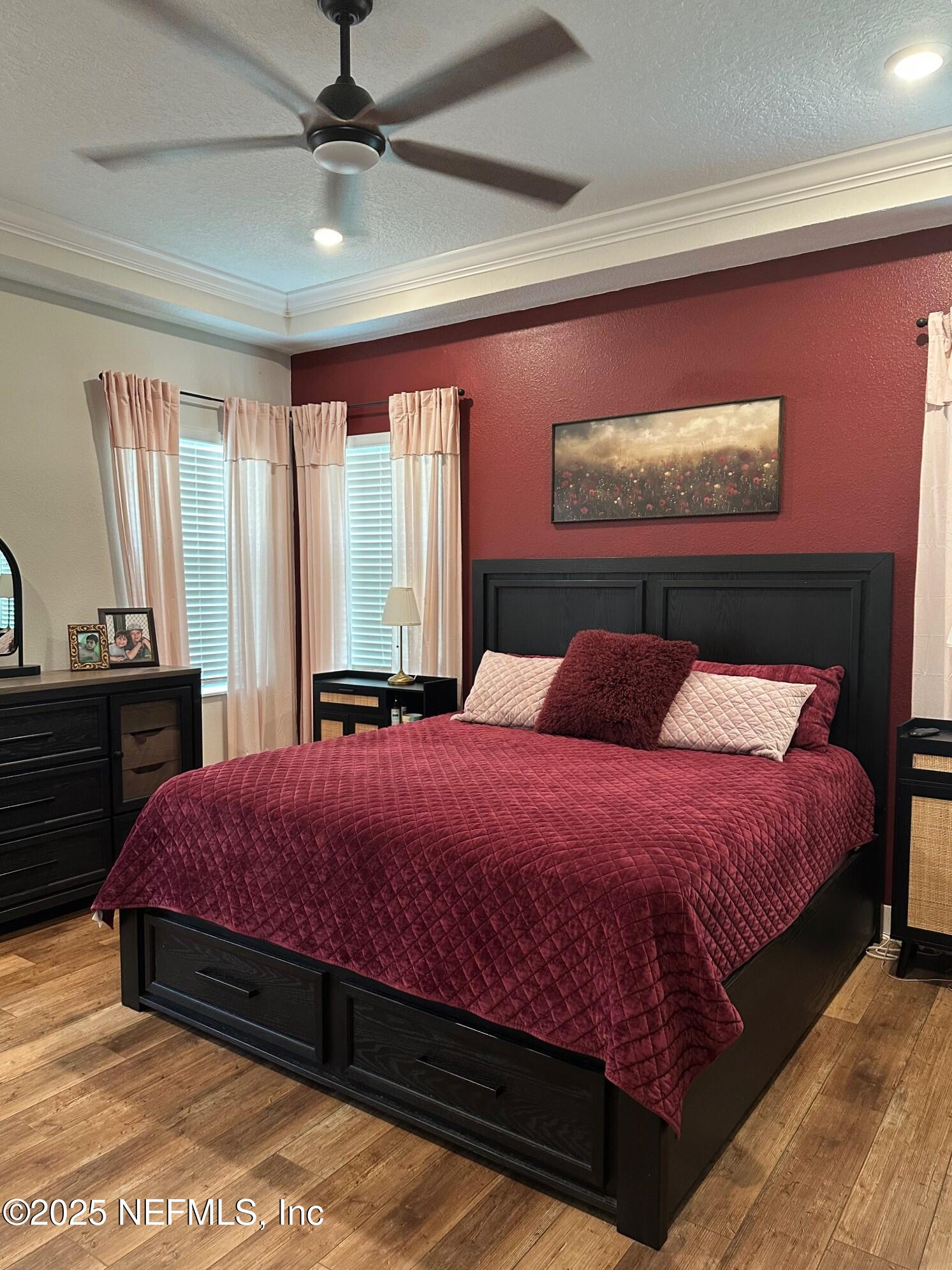 36079 Pitch Lane Hilliard, FL 32046 - Photo 11 of 35 a bedroom with a bed and window