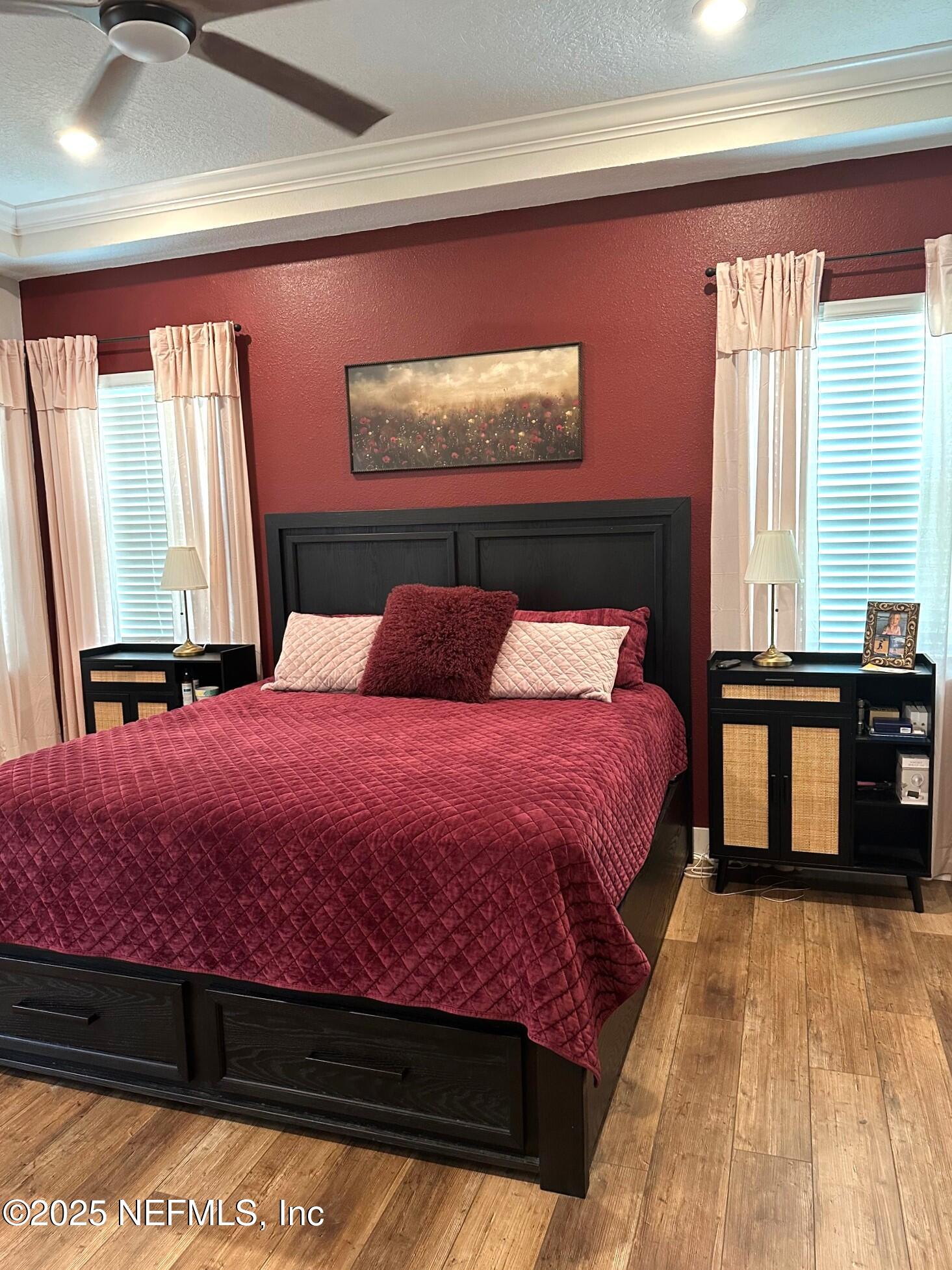 36079 Pitch Lane Hilliard, FL 32046 - Photo 12 of 35 a bedroom with a bed and a potted plant