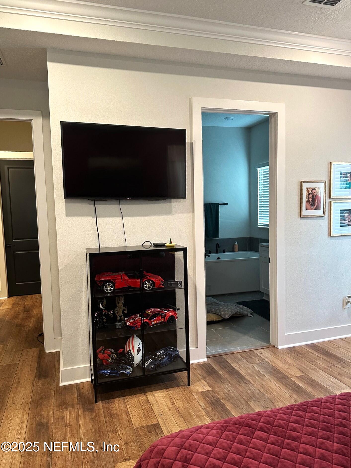 36079 Pitch Lane Hilliard, FL 32046 - Photo 13 of 35 a bedroom with a bed and a television