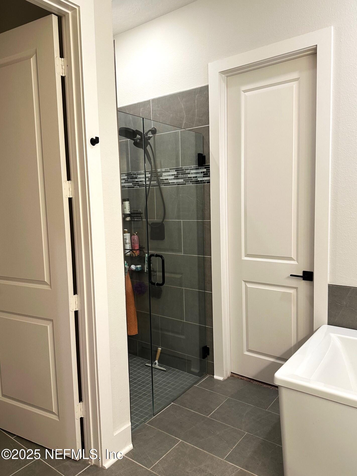 36079 Pitch Lane Hilliard, FL 32046 - Photo 14 of 35 a bathroom with a shower and toilet