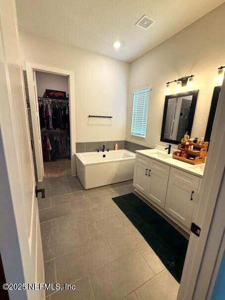 36079 Pitch Lane Hilliard, FL 32046 - Photo 15 of 35 a en suite bathroom with a double vanity sink and mirror