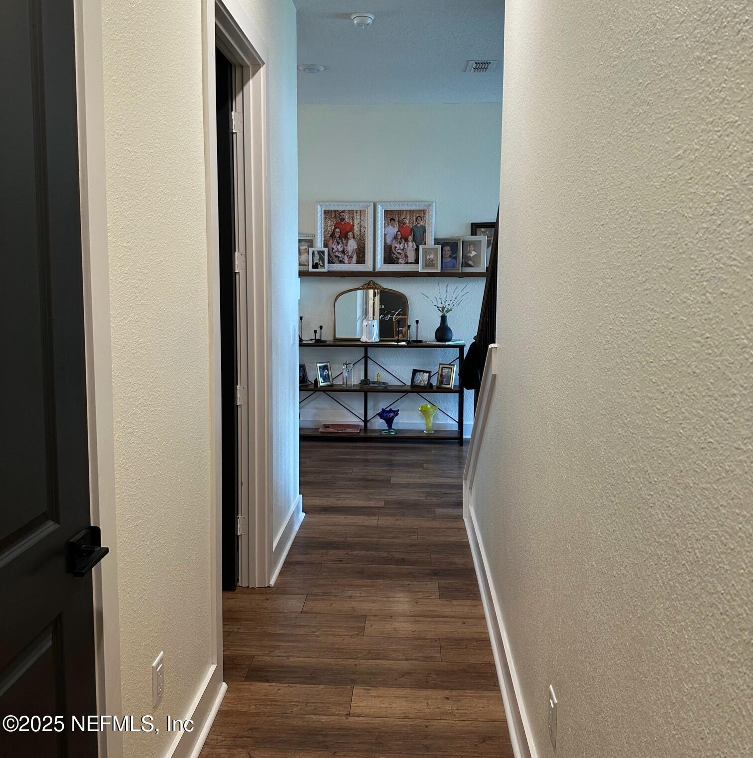 36079 Pitch Lane Hilliard, FL 32046 - Photo 18 of 35 a view of a hallway with wooden shelves