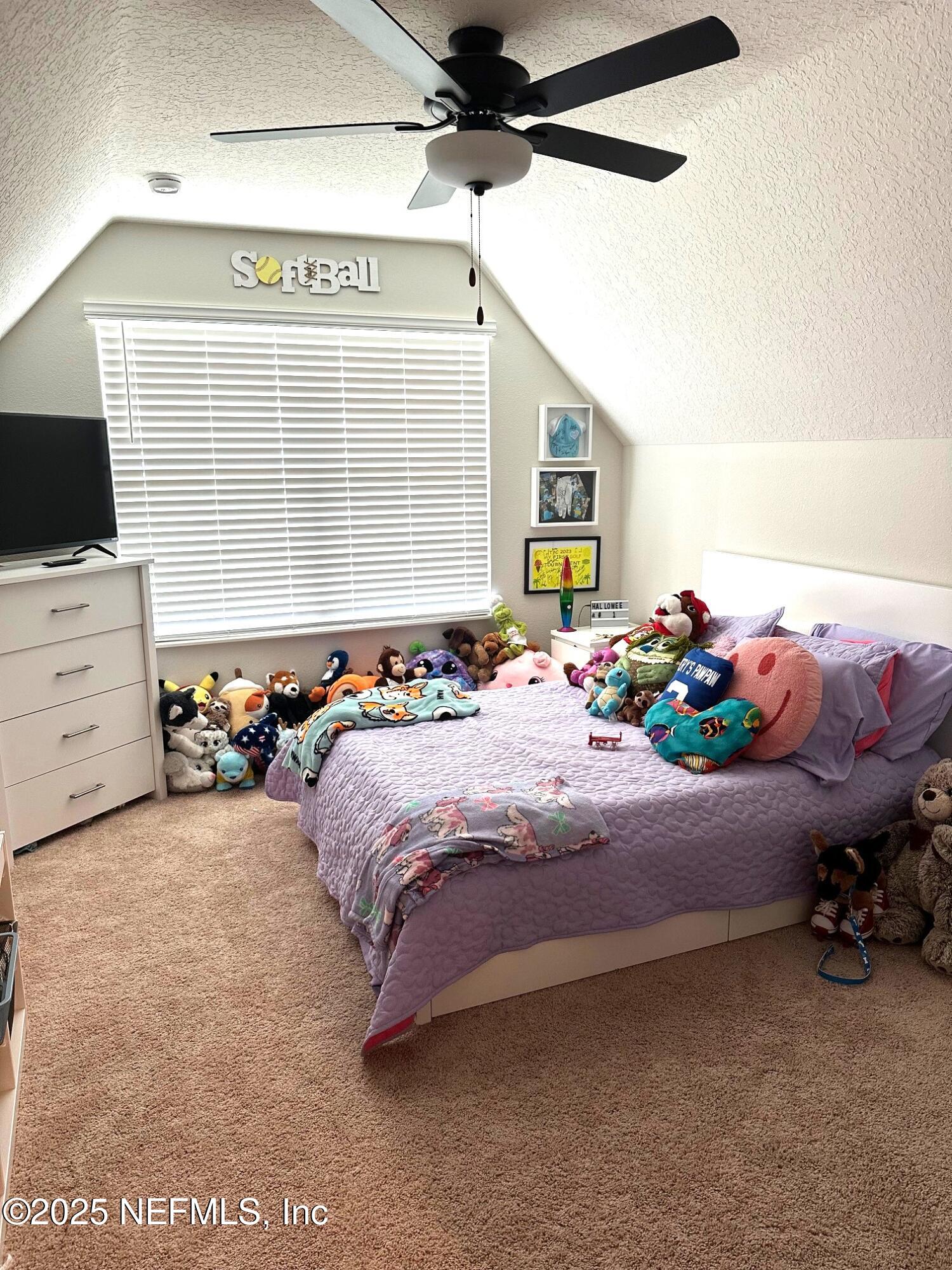 36079 Pitch Lane Hilliard, FL 32046 - Photo 24 of 35 a bedroom with a bed dresser and a window