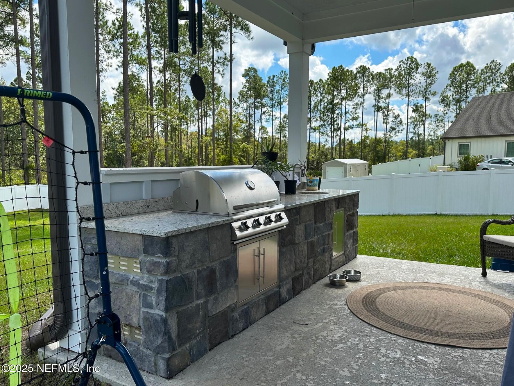 36079 Pitch Lane Hilliard, FL 32046 - Photo 32 of 35 a view of a kitchen with a sink and swing