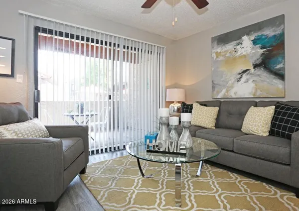 a living room with furniture and a large window