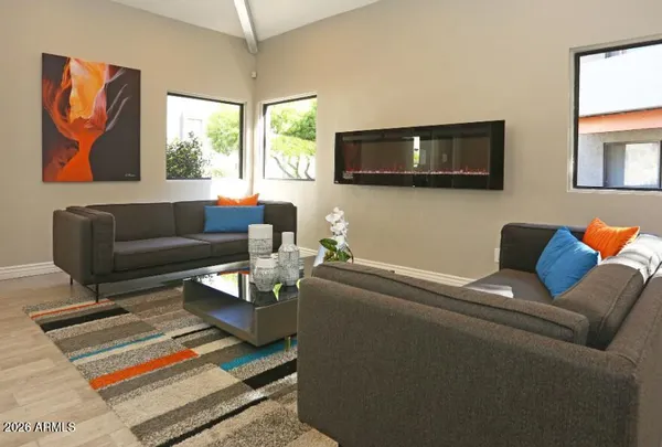 a living room with furniture and a flat screen tv