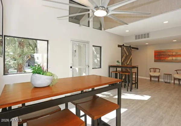 a living room with a table and chairs