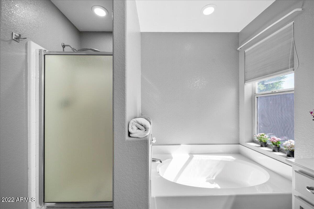 1836 East Darrel Road Phoenix, AZ 85042 - Photo 18 of 28 a bathroom with a tub and shower