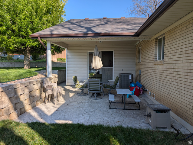 1411 Millbrook Way Bountiful, UT 84010 - Photo 3 of 36 Covered stamped concrete patio with direct outdoor access