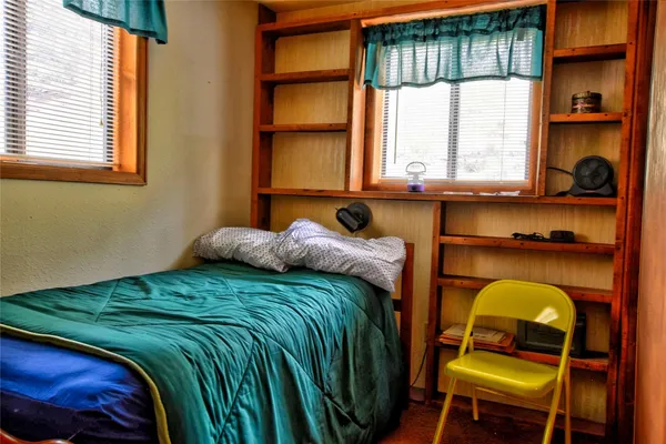 a room with furniture and mirror