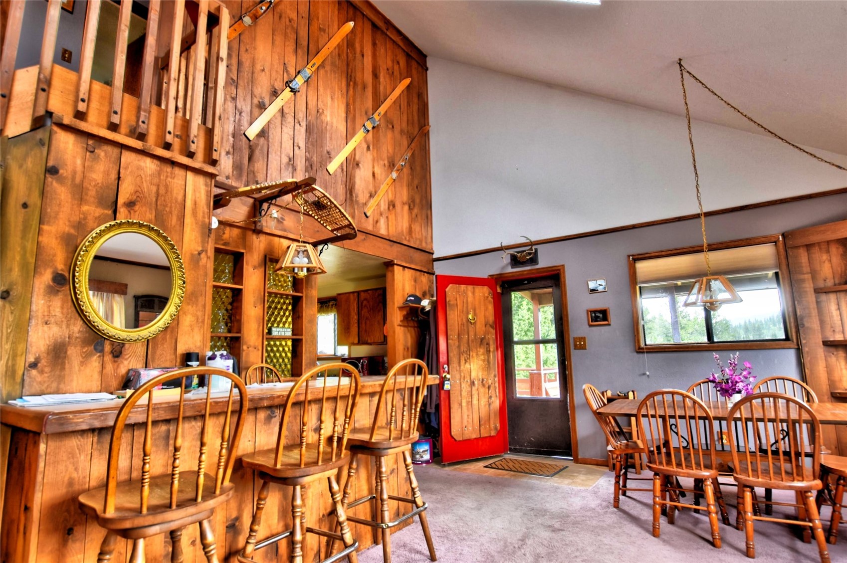 1722 Stagestop Road Jefferson, CO 80456 - Photo 8 of 26 a view of a dining room with furniture and chandelier