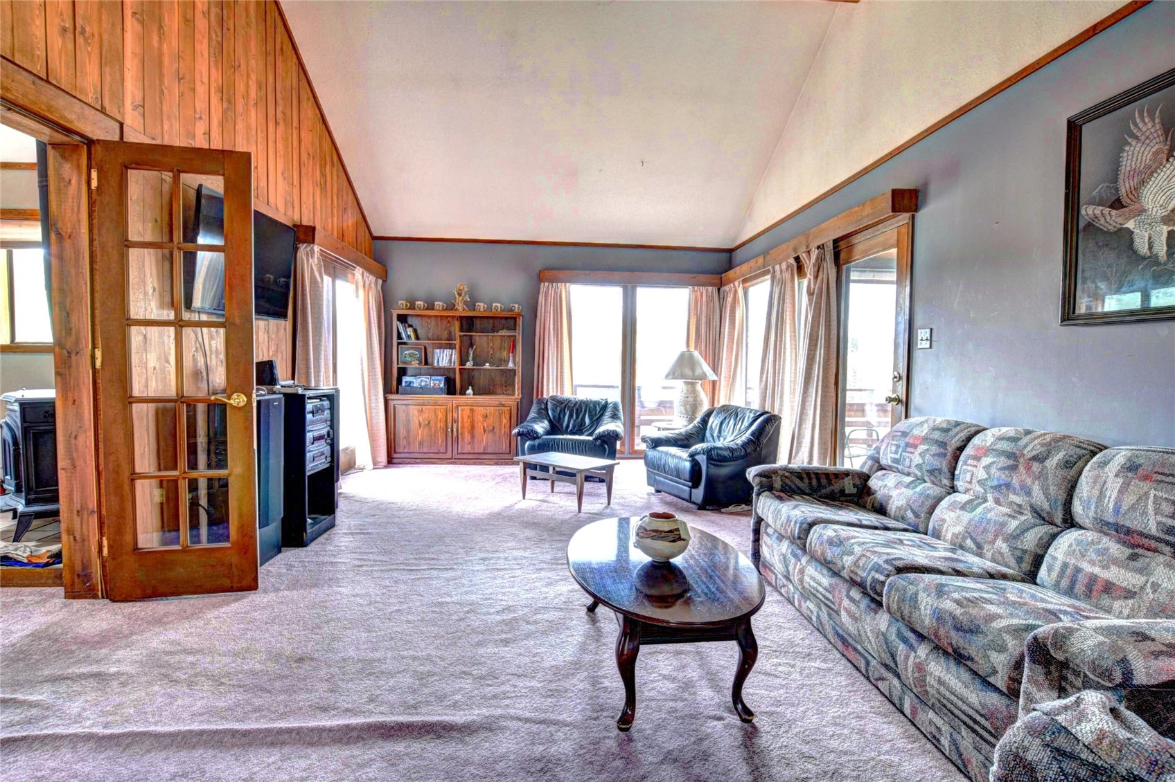 1722 Stagestop Road Jefferson, CO 80456 - Photo 10 of 26 a living room with furniture fireplace and a large window