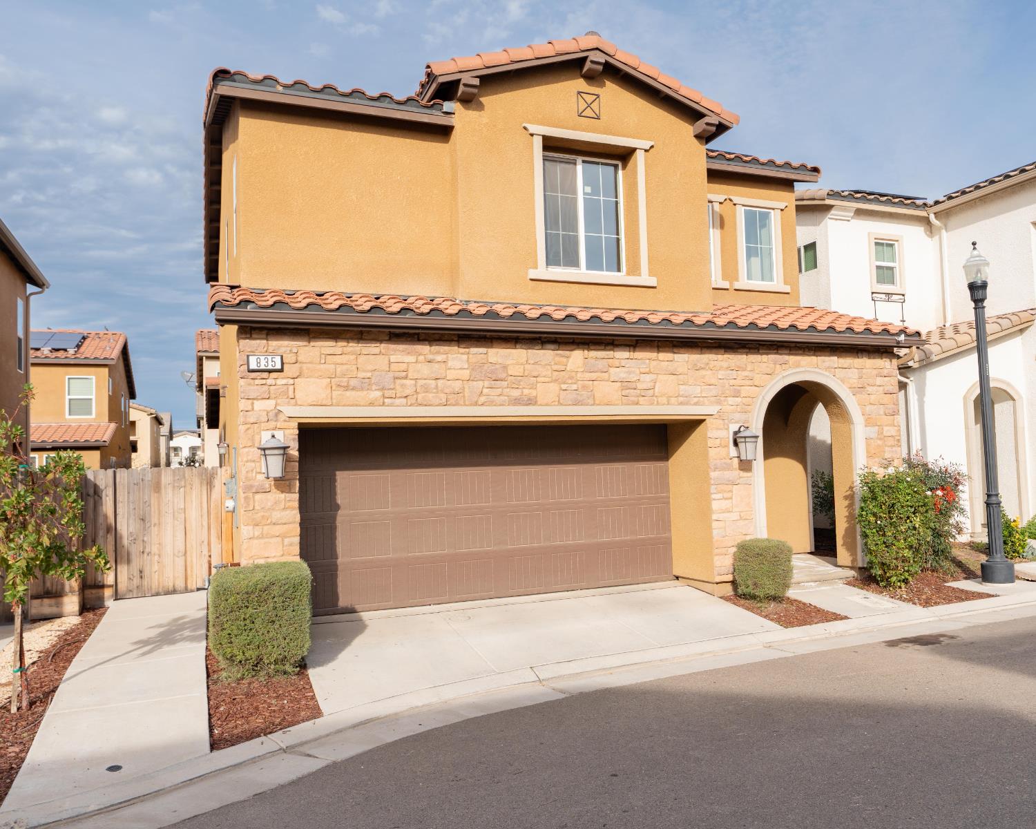 835 Fir Street Madera, CA 93636 - Photo 1 of 21 a front view of a house with garden
