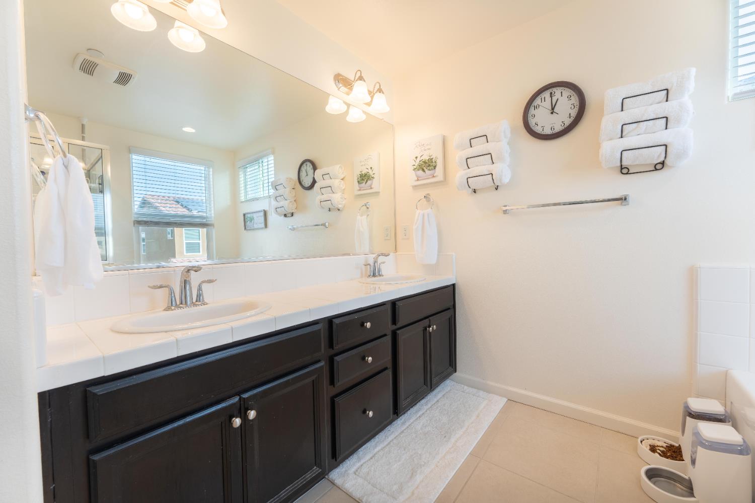 835 Fir Street Madera, CA 93636 - Photo 13 of 21 a bathroom with a sink and a mirror