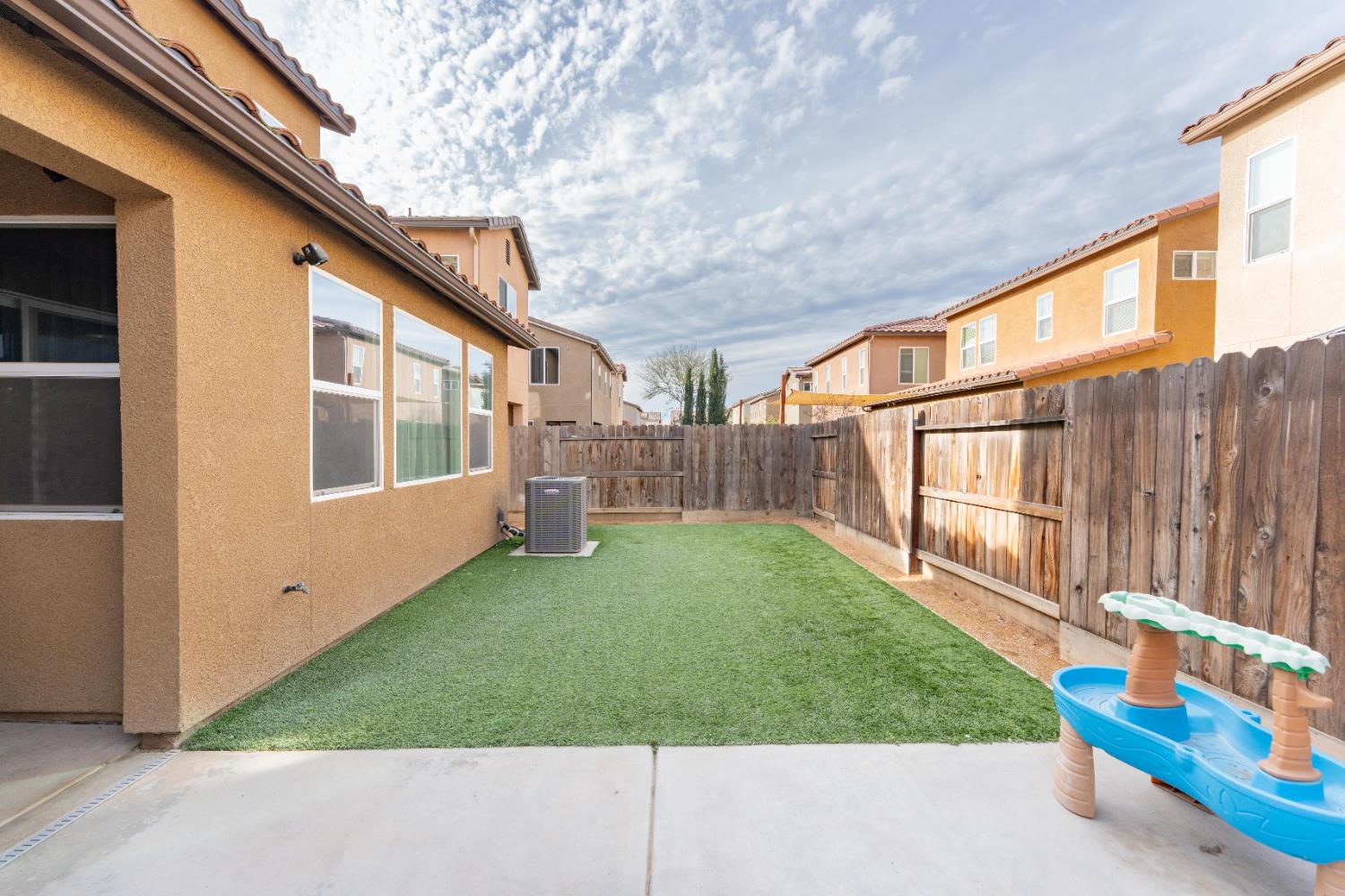 835 Fir Street Madera, CA 93636 - Photo 19 of 21 a view of backyard with outdoor seating and stairs