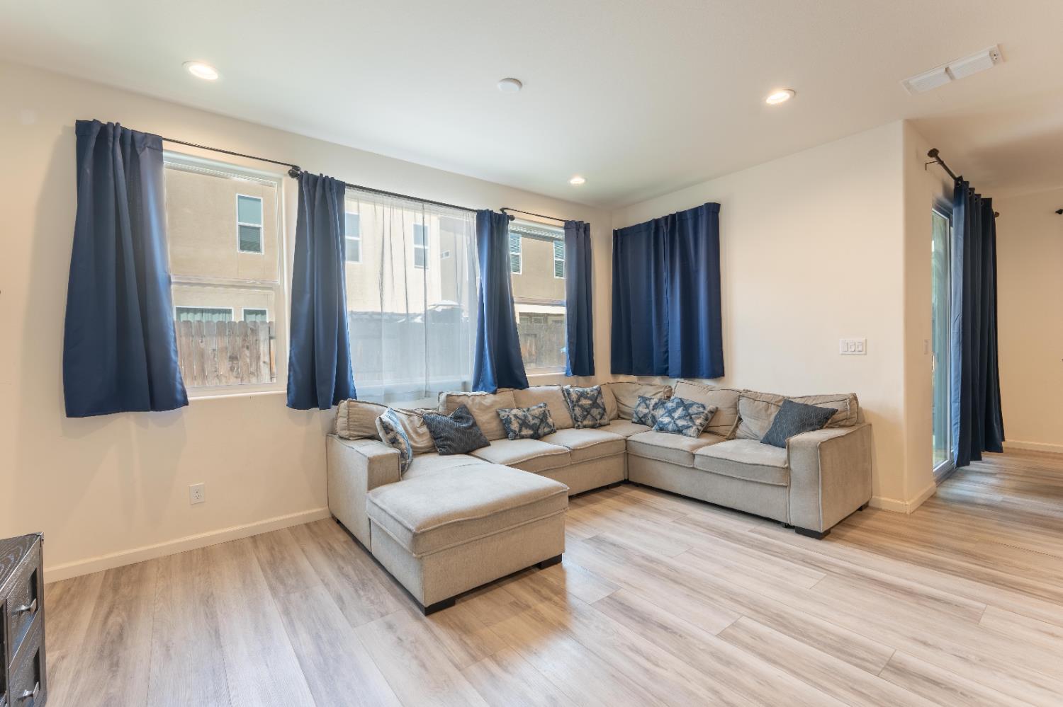 835 Fir Street Madera, CA 93636 - Photo 8 of 21 a living room with furniture and a flat screen tv