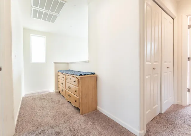 a view of kitchen with granite countertop cabinets and sink