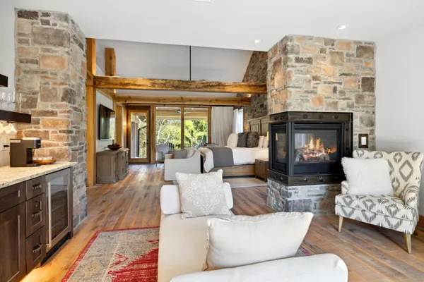 a living room with fireplace furniture and a fireplace