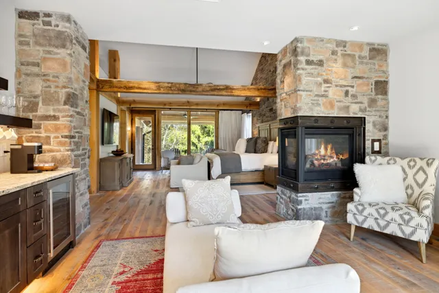 a living room with fireplace furniture and a fireplace