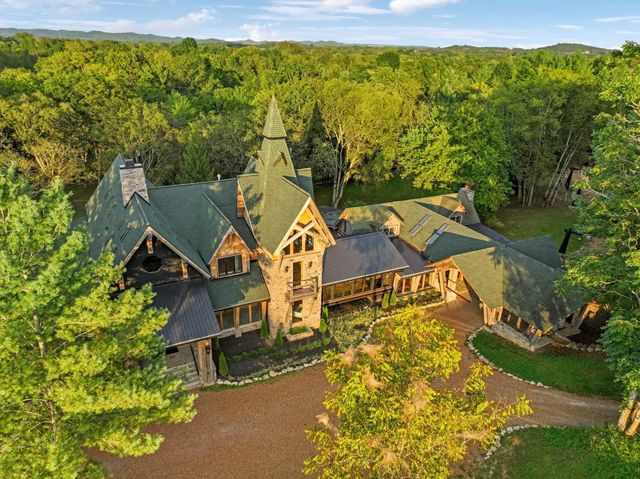 a aerial view of a house with a yard