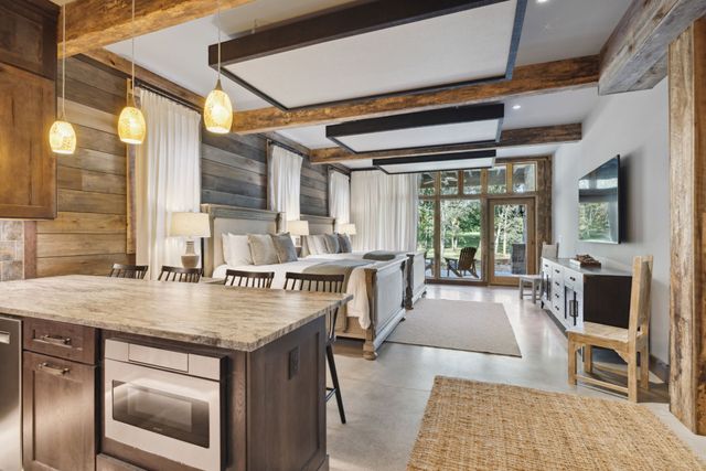 a front view of a house with a dirt road and a road