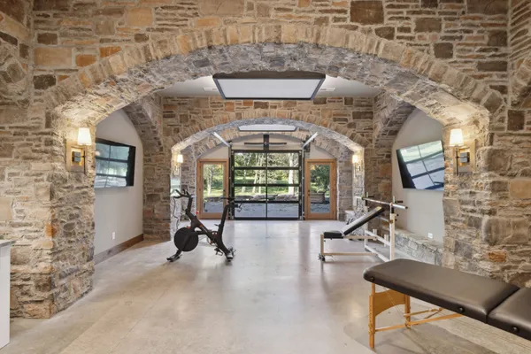a view of a patio with table and chairs a barbeque with wooden floor and fence