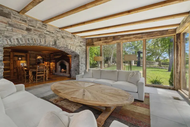 a living room with furniture and windows