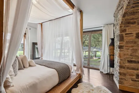 a bathroom with a shower sink and mirror