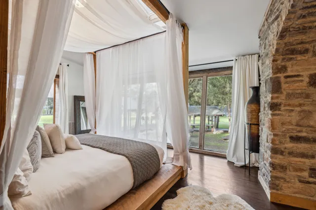 a bathroom with a shower sink and mirror