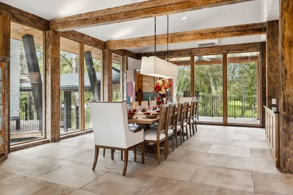 a view of a dining room with furniture window and outside view