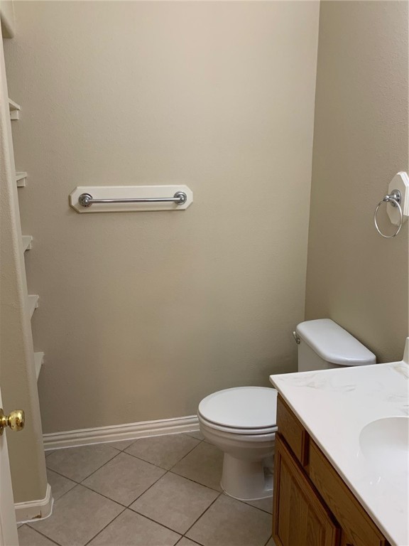 931 Moore Avenue Portland, TX 78374 - Photo 7 of 17 a white toilet sitting next to a white sink