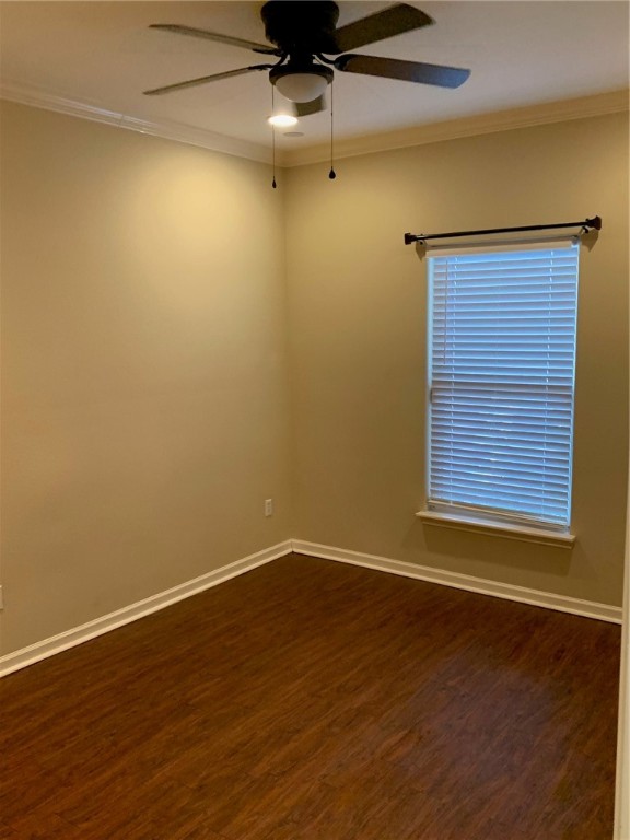 931 Moore Avenue Portland, TX 78374 - Photo 8 of 17 a view of an empty room with wooden floor and a window