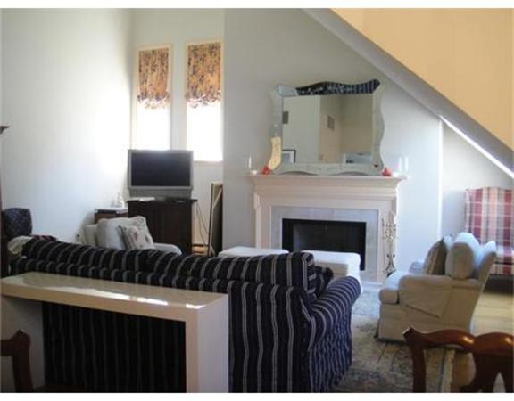 63 Garden Road, Unit G8 Wellesley, MA 02481 - Photo 2 of 12 a living room with furniture and a fireplace